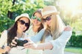 Selfie. Three attractive girls taking picture at summer holidays,