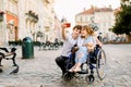 Selfie time. Handsome happy young man hugging his disabled young pretty woman and smiling while taking selfie with her Royalty Free Stock Photo