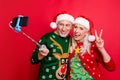 Selfie time video call blogging concept. Photo portrait of two gray white haired cheerful crazy in traditional clothes v Royalty Free Stock Photo