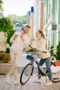 Man taking selfie on smartphone with woman on bicycle. Royalty Free Stock Photo