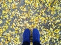 Selfie woman feet wearing blue sneaker and yellow