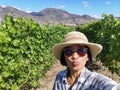 Selfie woman travel in vinyards, Okanagan valley, British Columbia Canada