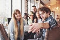 Selfie of young smiling teenagers having fun together. Best friends taking selfie outdoors with backlighting. Happy Royalty Free Stock Photo