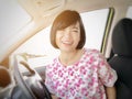 Selfies of girl smiling or Asian woman smiling in the car and looking at camera Royalty Free Stock Photo