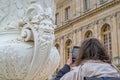Selfies and photographing with a phone - a tourist taking pictures