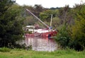 Selfmade sailboat crossing the river Meuse