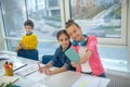 Two girls making selfie at school using a smartphone Royalty Free Stock Photo