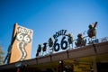 SELIGMAN - Vintage cars along Route 66. Figurines on the top of a restaurant. Royalty Free Stock Photo