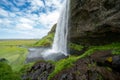 Seljalandsfoss waterfall in Iceland, approaching the back side of the falls Royalty Free Stock Photo