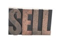 'SELL' in old wood type Royalty Free Stock Photo