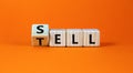 Sell or tell symbol. Turned wooden cubes and changed the concept word Tell to Sell. Beautiful orange table orange background, copy Royalty Free Stock Photo