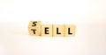 Sell or tell symbol. Turned wooden cubes and changed the concept word Tell to Sell. Beautiful white table white background, copy Royalty Free Stock Photo