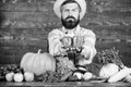 Sell vegetables. Farmer straw hat with fresh harvest. Homegrown harvest concept. Typical farmer guy. Farm market harvest