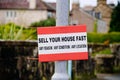 Sell your house fast sign outside residential area during property crisis Royalty Free Stock Photo