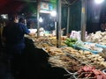 Seller and buyer nasi kucing or angkringan, junk food, gorengan, small size night street food at yogyakarta