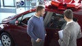 The seller of cars tells the buyer the characteristics of the car