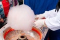 The seller of cotton candy forms a lump for sale Royalty Free Stock Photo