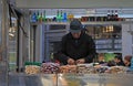 Seller is cutting something in kiosk, Milan Royalty Free Stock Photo