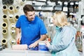 Seller demonstrating paint roller to buyer Royalty Free Stock Photo