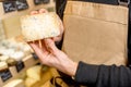 Holding a blue cheese at the store Royalty Free Stock Photo