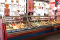 Seller of ice cream that is preparing an ice cream Royalty Free Stock Photo