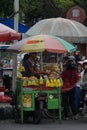 The seller of manisan. Candied golden apple fruit (manisan kedondong)