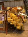 A seller of potato chips on the sidewalk and the presence of other small shops in the city of Baghdad