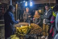 Seller of roasted chestnuts and buyers