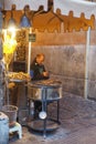 Seller of roasted chestnuts in Rome, Italy