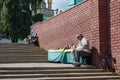 The seller of Russian nesting dolls in front of the Sergiev Posad monastery. Sergiev Posad, Russia