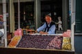 The seller sells the famous Flemish cone-shaped candies cuberdon on Ghent Street