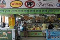 The seller sells various types of meat and cheese products at La Vega Central Market in Santiago, Chile 2