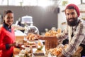 Seller serving a cake to the customer