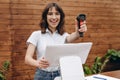 Seller smiling and holding barcode scanner in a hand Royalty Free Stock Photo