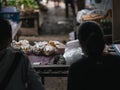 Seller waiting for the customer at the fresh chicken stall in the Saturday flea market