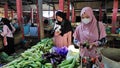Sellers and buyers in traditional Indonesian markets