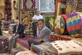 Sellers of Persian rugs in the carpets shop, Shiraz, Iran.