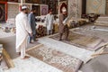 Sellers show exquisite carpets in the store in Masafi Friday market on Dubai-Fujairah road Royalty Free Stock Photo