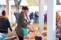 Selling cakes in a farmers market.