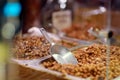 Selling of candied nuts on Krakow Christmas market. Street food, snacks and sweets on traditional Xmas market