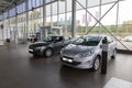 Selling cars Peugeot 301 and 408 in the showroom. New products automaker Peugeot