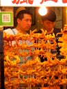 Selling crab skewers in busy night street market. Xi& x27;An China. Royalty Free Stock Photo