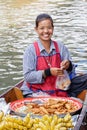 Selling food at the Damnoen Saduak floating market, Bangkok Thailand