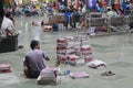 Selling morning papers on a Mumbai station