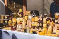 Selling organic natural bio honey, pollen, beeswax candles and other bee products in a street food market