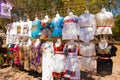 Selling traditional Mexican clothes with floral embroidery and t-shirts with skull painted on the street market in Mexico