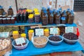 Selling Turkish olives in local market place in Turkey. Marinaded green and black olives.