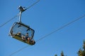 Selva Gardena -Trentino Alto adige - 07/19/2016 People sitting on the chairlift during a summer hike in the mountains