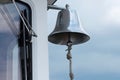 Selver bell on the side of a boat