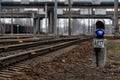 Semaphore with burning blue light. The intersection of railway tracks. - Image Royalty Free Stock Photo